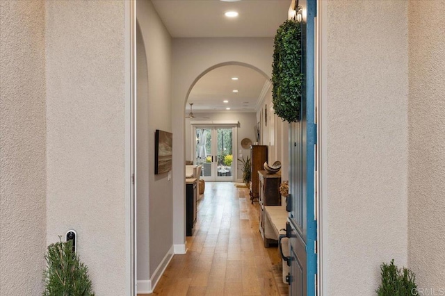 3482 Corte Fortuna, Carlsbad, CA 92009 - hall featuring recessed lighting, light wood-style floors, arched walkways, crown molding, and baseboards
