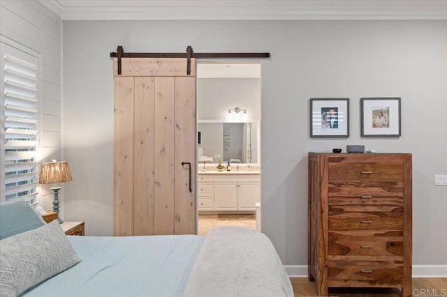 3482 Corte Fortuna, Carlsbad, CA 92009 - bedroom with ornamental molding, baseboards, a barn door, and connected bathroom