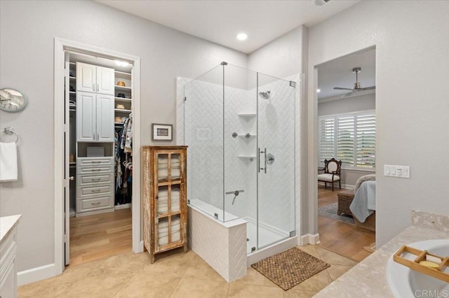 3482 Corte Fortuna, Carlsbad, CA 92009 - full bath with vanity, a shower stall, ceiling fan, a walk in closet, and wood finished floors
