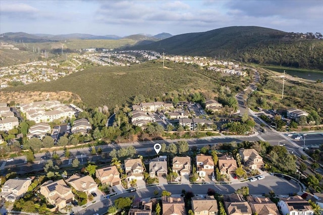 3482 Corte Fortuna, Carlsbad, CA 92009 - aerial overview of property's location with nearby suburban area and a mountainous background