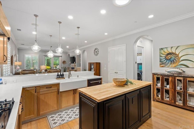 3482 Corte Fortuna, Carlsbad, CA 92009 - kitchen featuring arched walkways, butcher block counters, a sink, recessed lighting, and light wood finished floors