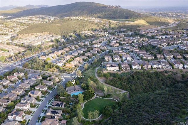 3482 Corte Fortuna, Carlsbad, CA 92009 - aerial overview of property's location featuring nearby suburban area and a mountainous background