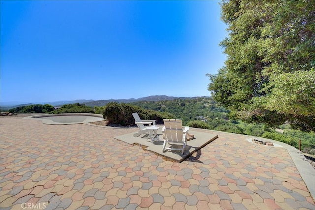 view of patio / terrace with a mountain view