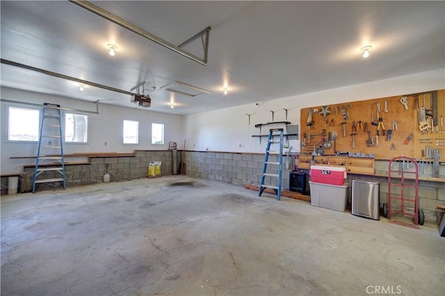 garage featuring a workshop area and a garage door opener