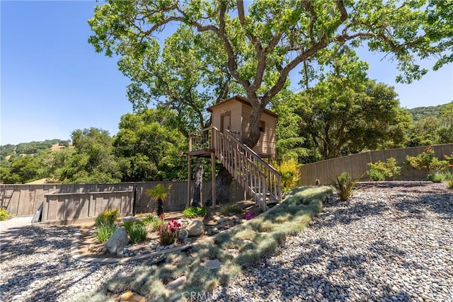 11620 Cenegal Rd, Atascadero, CA 93422 - fenced backyard featuring stairs and a wooden deck