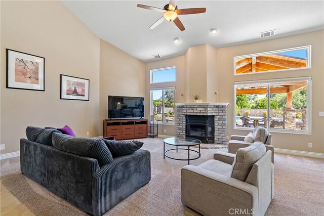 11620 Cenegal Rd, Atascadero, CA 93422 - living area with high vaulted ceiling, light carpet, baseboards, ceiling fan, and a fireplace