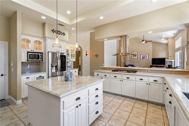 11620 Cenegal Rd, Atascadero, CA 93422 - kitchen featuring stainless steel appliances, island exhaust hood, light tile patterned floors, glass insert cabinets, and a kitchen island