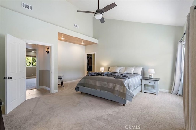 11620 Cenegal Rd, Atascadero, CA 93422 - carpeted bedroom with baseboards, a walk in closet, high vaulted ceiling, and ceiling fan