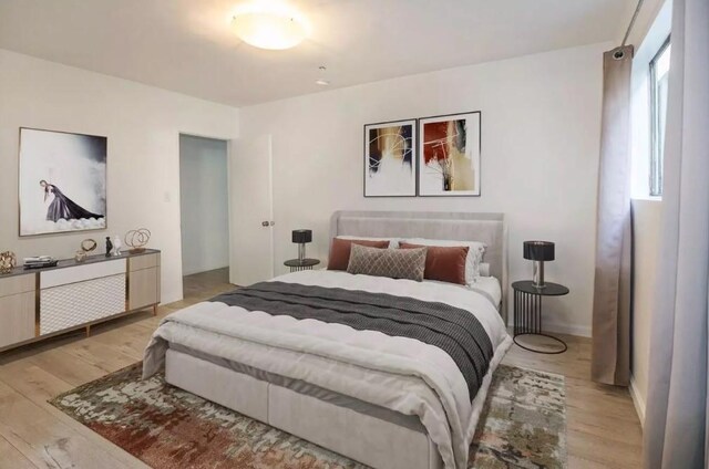 2309 Hauser Blvd, Los Angeles, CA 90016 - bedroom with light wood-style flooring