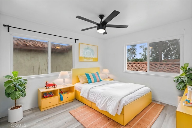 1558 Camelot Dr, Corona, CA 92882 - bedroom featuring wood finished floors and a ceiling fan