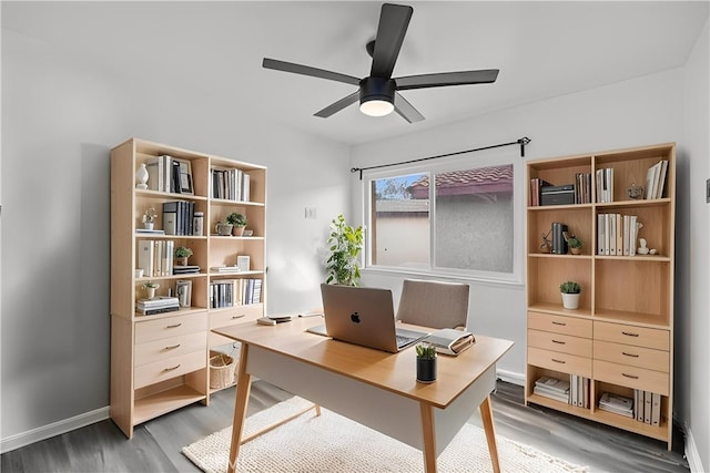 1558 Camelot Dr, Corona, CA 92882 - home office with wood finished floors, a ceiling fan, and baseboards