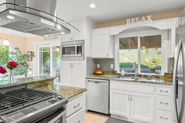10440 N Karen Ave, Oak View, CA 93022 - kitchen with stainless steel appliances, ventilation hood, a sink, backsplash, and white cabinetry