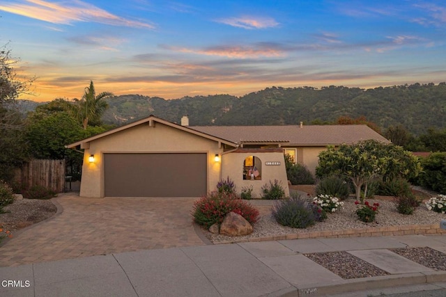 10440 N Karen Ave, Oak View, CA 93022 - view of front of house featuring a chimney, stucco siding, driveway, a garage, and fence