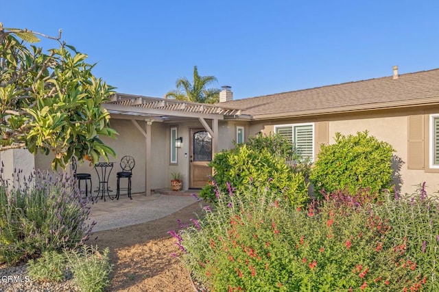 10440 N Karen Ave, Oak View, CA 93022 - back of house with a pergola, a chimney, a patio area, and stucco siding