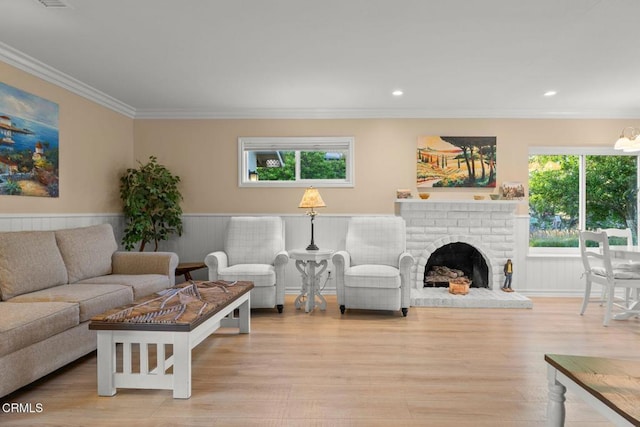 10440 N Karen Ave, Oak View, CA 93022 - living room with crown molding, plenty of natural light, wood finished floors, recessed lighting, and a brick fireplace
