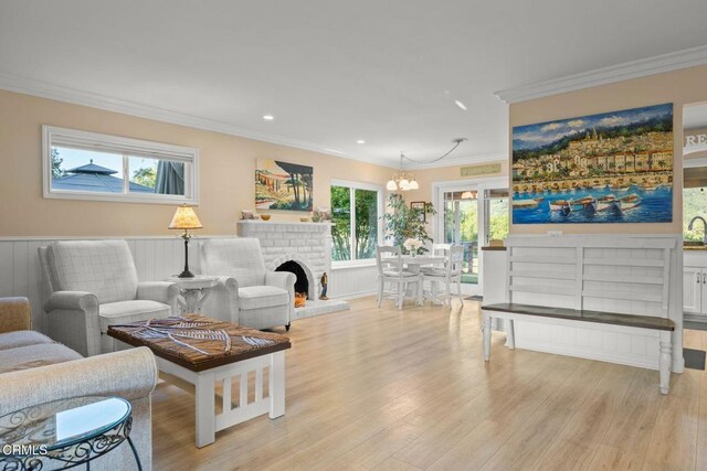 10440 N Karen Ave, Oak View, CA 93022 - living room with a chandelier, light wood-style flooring, ornamental molding, recessed lighting, and wainscoting