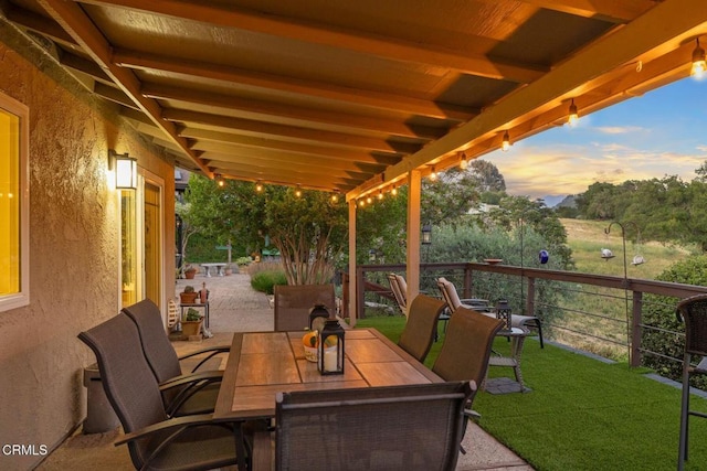 10440 N Karen Ave, Oak View, CA 93022 - patio terrace at dusk with outdoor dining area and a lawn