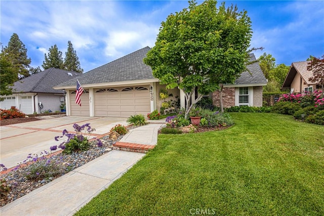 8435 Sale Ave, West Hills, CA 91304 - view of front of house with an attached garage, driveway, a shingled roof, and a front lawn