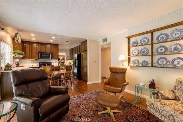 8435 Sale Ave, West Hills, CA 91304 - living room featuring dark wood-type flooring, a textured ceiling, crown molding, baseboards, and recessed lighting