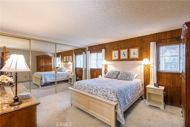 8435 Sale Ave, West Hills, CA 91304 - bedroom featuring light carpet, a textured ceiling, a closet, and wooden walls