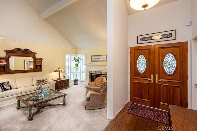 8435 Sale Ave, West Hills, CA 91304 - entrance foyer with beam ceiling, high vaulted ceiling, a fireplace, wood finished floors, and baseboards