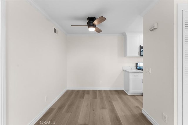8990 19th St Unit 376, Rancho Cucamonga, CA 91701 - empty room featuring a ceiling fan, light wood-style flooring, crown molding, and baseboards
