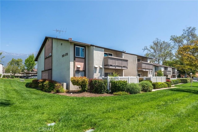 8990 19th St Unit 376, Rancho Cucamonga, CA 91701 - rear view of house with a yard