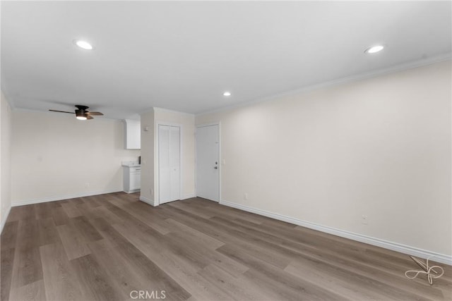 8990 19th St Unit 376, Rancho Cucamonga, CA 91701 - unfurnished living room with ornamental molding, a ceiling fan, wood finished floors, baseboards, and recessed lighting