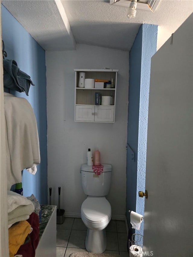 4391 Triggs St, Los Angeles, CA 90023 - bathroom featuring tile patterned floors, a textured ceiling, and toilet