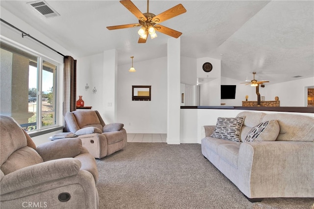 11020 Blue Jay Way, Oak Hills, CA 92344 - tiled living area with a ceiling fan, carpet flooring, vaulted ceiling, a textured ceiling, and baseboards