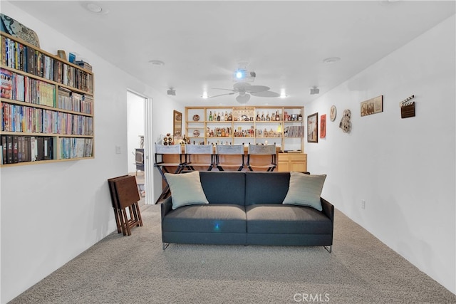 11020 Blue Jay Way, Oak Hills, CA 92344 - carpeted living area with bar area and a ceiling fan