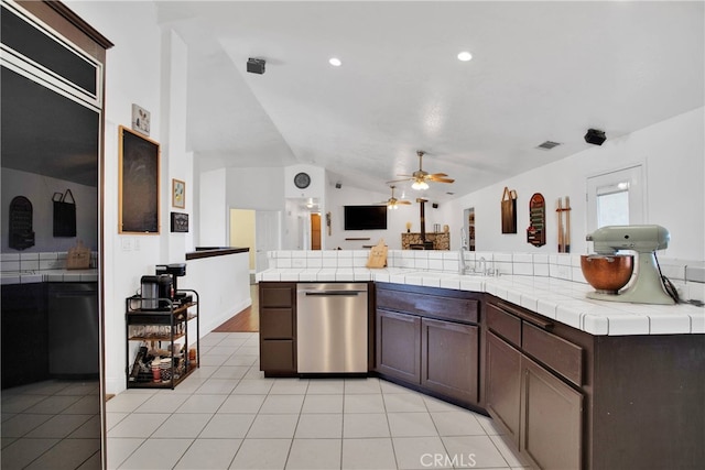 11020 Blue Jay Way, Oak Hills, CA 92344 - kitchen featuring dishwasher, lofted ceiling, tile countertops, light tile patterned floors, and a ceiling fan