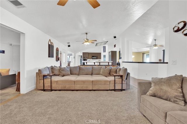 11020 Blue Jay Way, Oak Hills, CA 92344 - carpeted living area with ceiling fan, vaulted ceiling, and healthy amount of natural light