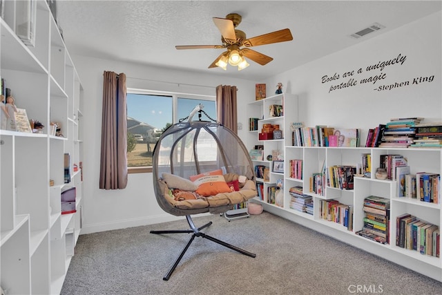 11020 Blue Jay Way, Oak Hills, CA 92344 - living area featuring carpet and ceiling fan