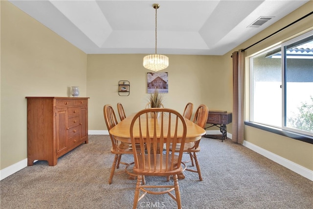 11020 Blue Jay Way, Oak Hills, CA 92344 - dining room featuring a raised ceiling, light carpet, a chandelier, and baseboards