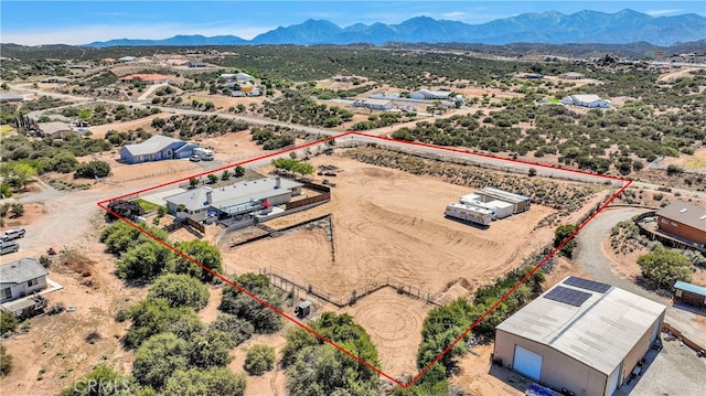 11020 Blue Jay Way, Oak Hills, CA 92344 - aerial view of sparsely populated area featuring property parcel outlined, a desert landscape, and a mountainous background