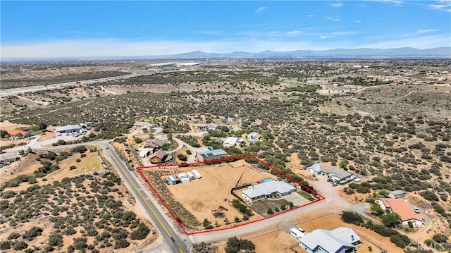 11020 Blue Jay Way, Oak Hills, CA 92344 - aerial view of sparsely populated area featuring property boundaries highlighted, a mountainous background, and a desert landscape