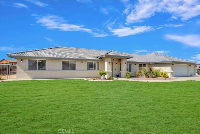 11020 Blue Jay Way, Oak Hills, CA 92344 - view of front of house featuring a tile roof, stucco siding, a garage, and driveway