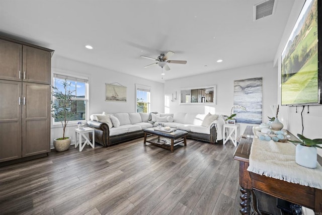 living area featuring ceiling fan, dark wood-type flooring, and recessed lighting