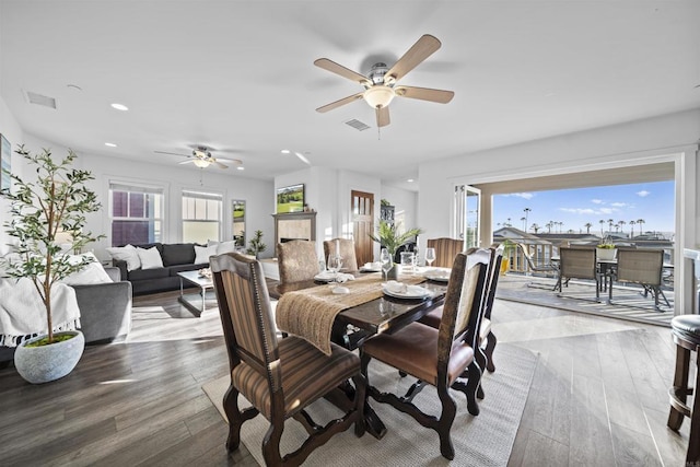 dining room with a ceiling fan, recessed lighting, and hardwood / wood-style flooring