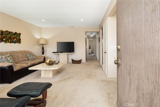 living room featuring carpet flooring and recessed lighting