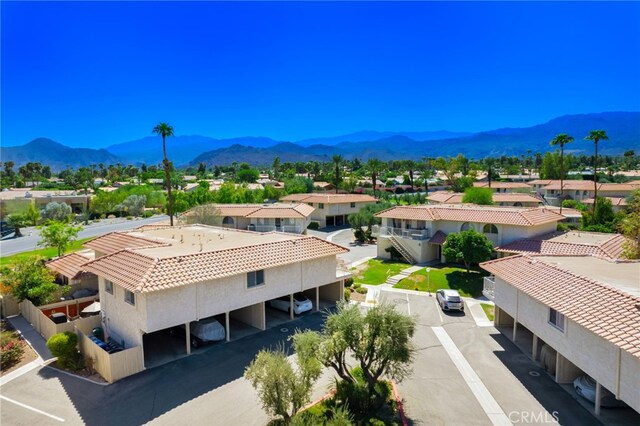 aerial view of residential area featuring a mountain backdrop
