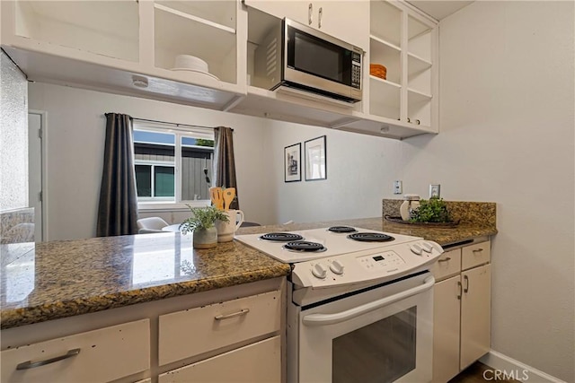 2240 Notre Dame Blvd Unit 6, Chico, CA 95928 - kitchen featuring white electric range oven, stainless steel microwave, white cabinetry, a peninsula, and dark stone counters