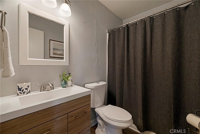 2240 Notre Dame Blvd Unit 6, Chico, CA 95928 - bathroom with toilet, a textured wall, vanity, and a shower with curtain