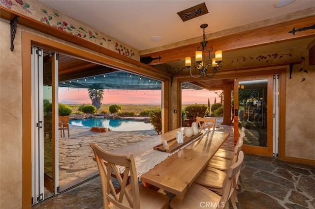 40125 Camino Del Vino, Temecula, CA 92592 - dining area with a chandelier and stone flooring