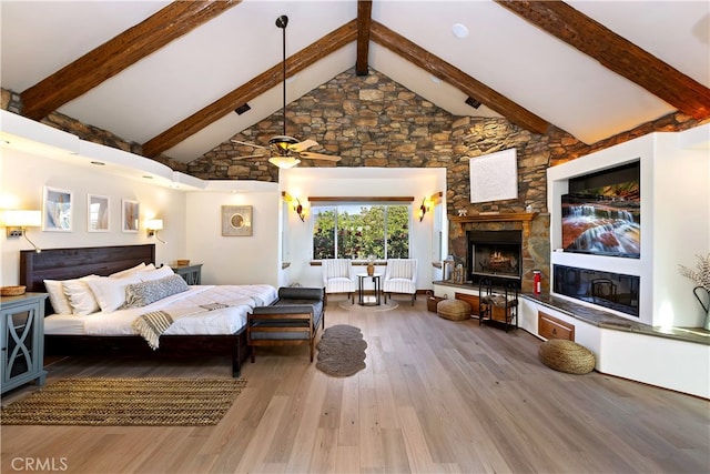 40125 Camino Del Vino, Temecula, CA 92592 - bedroom with a stone fireplace, beam ceiling, wood finished floors, and high vaulted ceiling