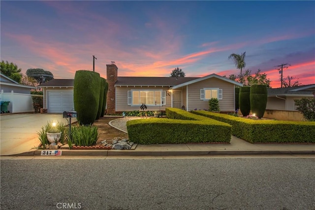 217 Syllmar Cir, Calimesa, CA 92320 - single story home with driveway and a chimney