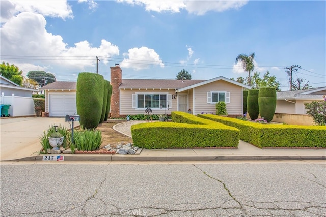 217 Syllmar Cir, Calimesa, CA 92320 - ranch-style house featuring driveway and a chimney