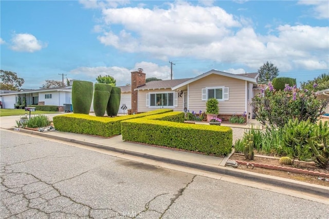 217 Syllmar Cir, Calimesa, CA 92320 - single story home featuring a chimney