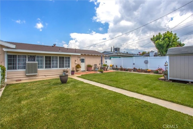 217 Syllmar Cir, Calimesa, CA 92320 - back of house with an outbuilding, a storage unit, a patio area, and cooling unit